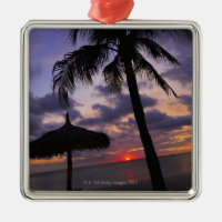 Aruba, silhouette of palm tree and palapa on metal ornament