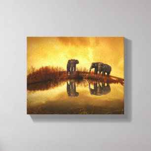 Asian Elephants in Thailand under a glowing sunset Canvas Print
