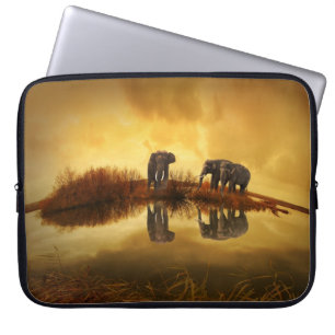 Asian Elephants in Thailand under a glowing sunset Laptop Sleeve