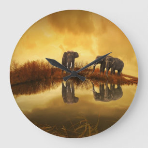 Asian Elephants in Thailand under a glowing sunset Large Clock