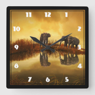 Asian Elephants in Thailand under a glowing sunset Square Wall Clock
