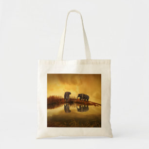 Asian Elephants in Thailand under a glowing sunset Tote Bag