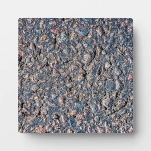 Asphalt and pebbles texture plaque