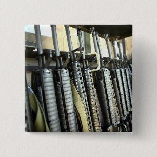 Assault rifles stand ready on the weapons rack button