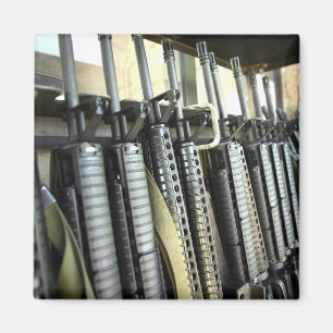 Assault rifles stand ready on the weapons rack magnet