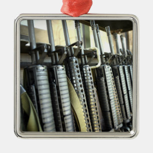 Assault rifles stand ready on the weapons rack metal ornament
