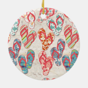 Assorted flip flops on sand, unique ceramic ornament
