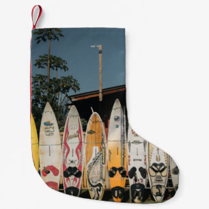 Assorted surfing boards stands on open field in th small christmas stocking