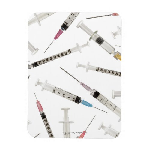 Assortment of syringes in various sizes and magnet
