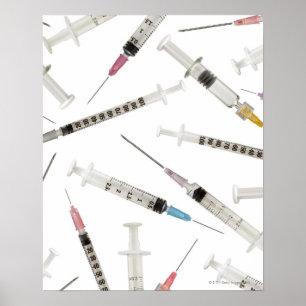 Assortment of syringes in various sizes and poster