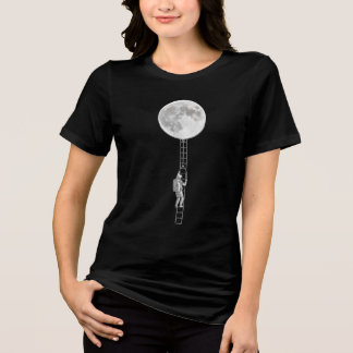 Astronaut Climbing the Moon – Surreal Space Art Tri-Blend Shirt