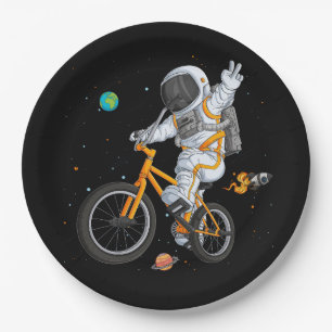 astronaut in spacesuit riding bmx bike on space ov paper plates