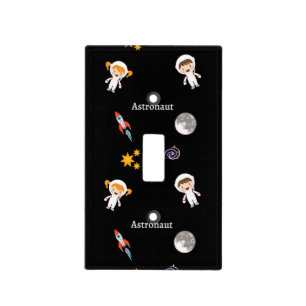 Astronaut job pattern on black light switch cover