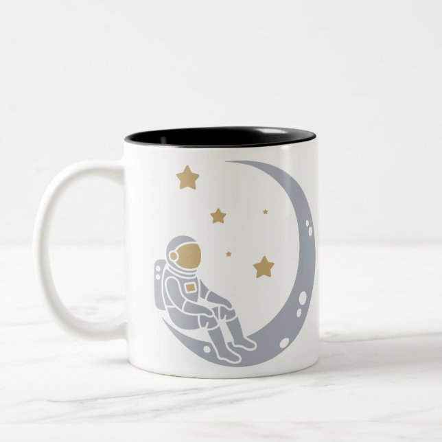 Astronaut on Crescent Moon Design Two-Tone Coffee Mug (Left)