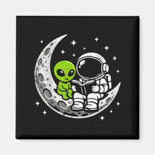 Astronaut reading book alien moon space magnet