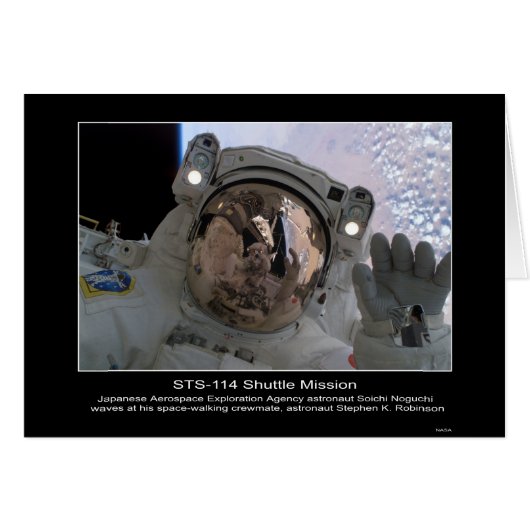 Astronaut Soichi Noguchi waves at astronaut Stephe (Front Horizontal)