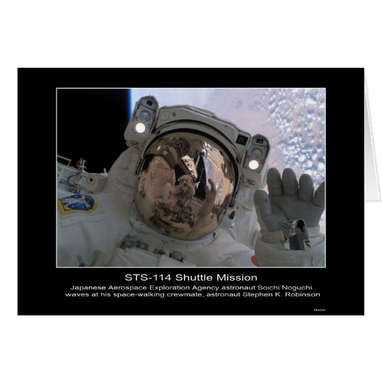 Astronaut Soichi Noguchi waves at astronaut Stephe Card