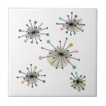 Atomic Era Colorful Starburst Mid Century Retro Ceramic Tile<br><div class="desc">This mid century modern decorative tile features shooting starbursts in the colors of turquoise,  orange,  tan,  avocado,  blue,  black and brown. This will make a fantastic addition to your tiling project or home decor.</div>