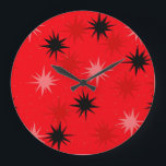 Atomic Red Starbursts Round Clock<br><div class="desc">This Atomic Red Starbursts Round Wall Clock has all of the mid century modern fun of your grandma’s kitchen, minus the sticky linoleum. The kitschy design features a red background with gold speckles and randomly placed starbursts in black, and shades of red and dark pink. This vintage inspired pattern is...</div>