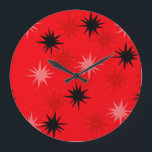 Atomic Red Starbursts Round Clock<br><div class="desc">This Atomic Red Starbursts Round Wall Clock has all of the mid century modern fun of your grandma’s kitchen, minus the sticky linoleum. The kitschy design features a red background with gold speckles and randomly placed starbursts in black, and shades of red and dark pink. This vintage inspired pattern is...</div>