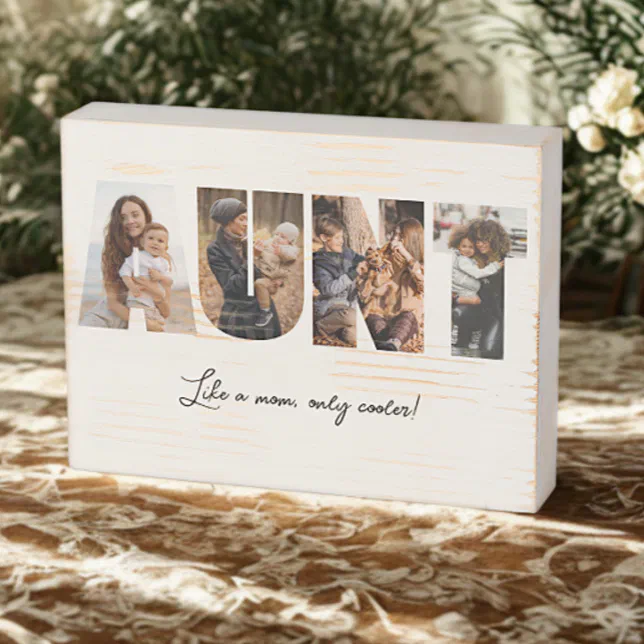 A wooden sign with the letters AUNT being used as picture frames. The background shows foliage and rustic patterns.