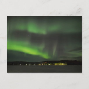 Aurora borealis in the sky postcard