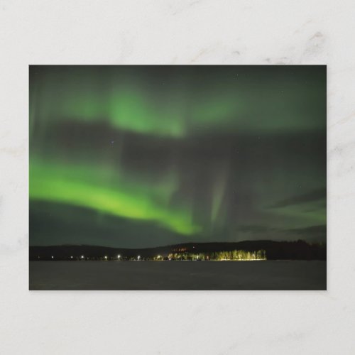 Aurora borealis in the sky postcard