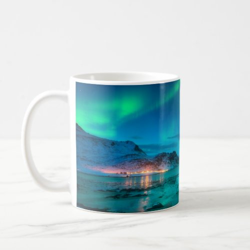 Aurora borealis over the sea coast snowy mountain coffee mug