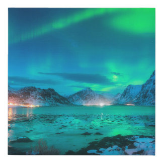 Aurora borealis over the sea coast, snowy mountain faux canvas print