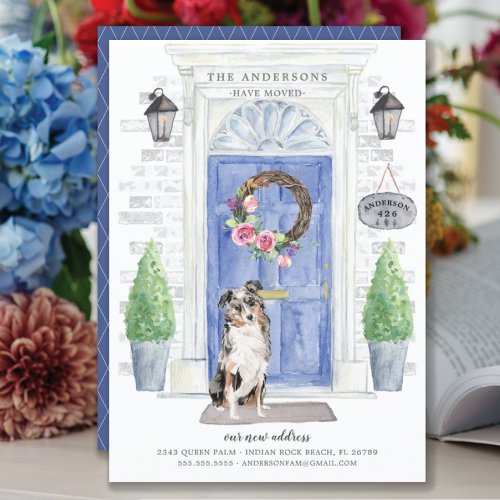 Australian Shepherd Front Door Moving Announcement - Announce your new address with our stylish announcement featuring a Australian Shepherd, blue front door, welcome mat, slate sign, topiaries and a floral wreath set on a gray brick background.