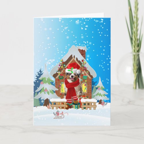 Australian shepherd in snow with Christmas gifts  Card