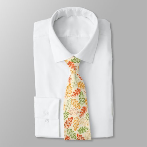 Autumn atmosphere with fall oak leaves on yellow tie