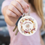 Autumn Dahlia Pumpkin Sweet Sixteen Keychain<br><div class="desc">Celebrate a special birthday with the warmth and beauty of autumn florals. This watercolor dahlia wreath surrounds a classic white pumpkin, creating a soft seasonal frame for a name curved above and an optional “Sweet 16” message below. The rich fall palette gives the piece a cozy, elegant feel while the...</div>