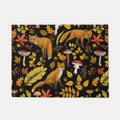 Autumn foxes on black doormat