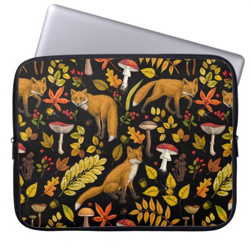 Autumn foxes on black laptop sleeve