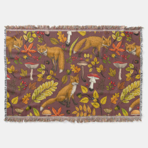 Autumn foxes on chocolate brown throw blanket