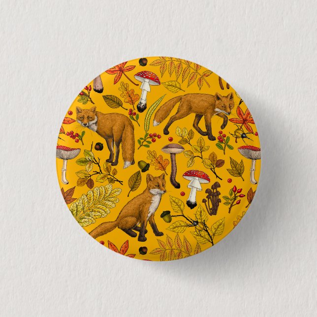Autumn foxes on orange button (Front)
