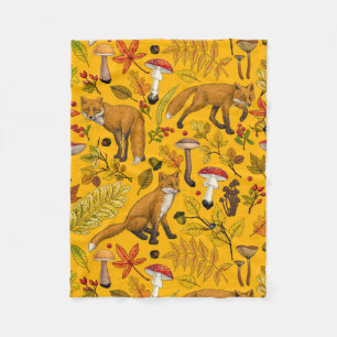Autumn foxes on orange fleece blanket