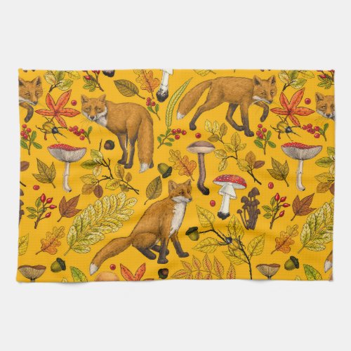 Autumn foxes on orange kitchen towel