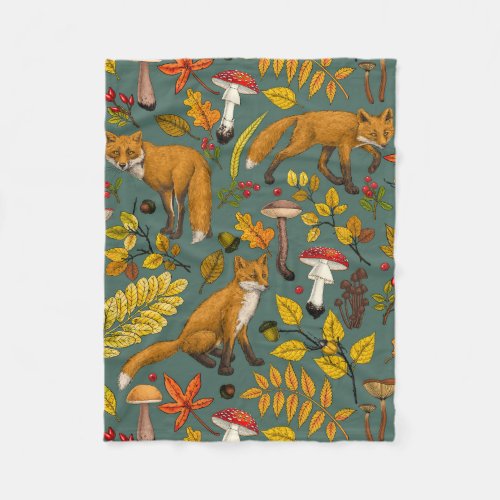 Autumn foxes on pine green fleece blanket
