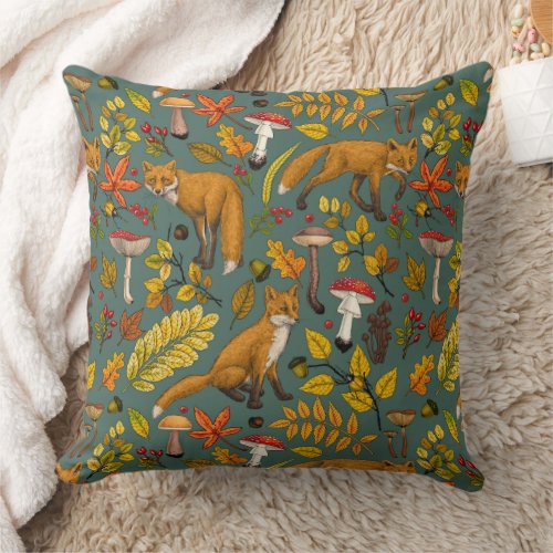 Autumn foxes on pine green throw pillow