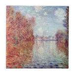 Autumn in Argenteuil by Claude Monet Ceramic Tile<br><div class="desc">Autumn in Argenteuil (1873) by Claude Monet is a vintage impressionist fine art nature painting featuring the River Seine with trees in autumn colors and Argenteuil in the distance. About the artist: Claude Monet (1840-1926) was a founder of the French impressionist painting movement with most of his paintings being "en...</div>