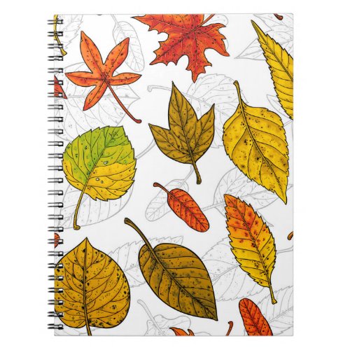 Autumn leaves on white notebook
