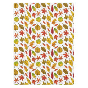 Autumn leaves on white tablecloth