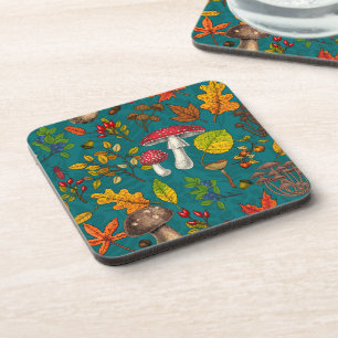 Autumn mushrooms, leaves, nuts and berries on blue beverage coaster