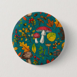 Autumn mushrooms, leaves, nuts and berries on blue button