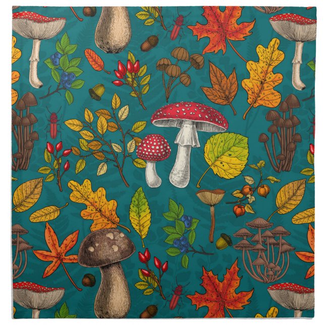 Autumn mushrooms, leaves, nuts and berries on blue cloth napkin (Front)