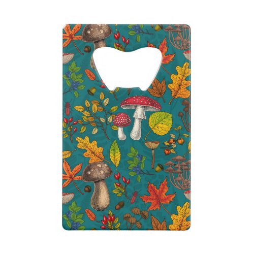 Autumn mushrooms leaves nuts and berries on blue credit card bottle opener