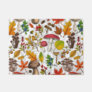 Autumn mushrooms, leaves, nuts and berries on blue doormat