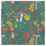 Autumn mushrooms, leaves, nuts and berries on blue fabric